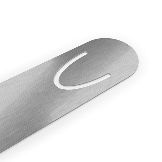 Close up of backside of book mark - silver metal curved.
