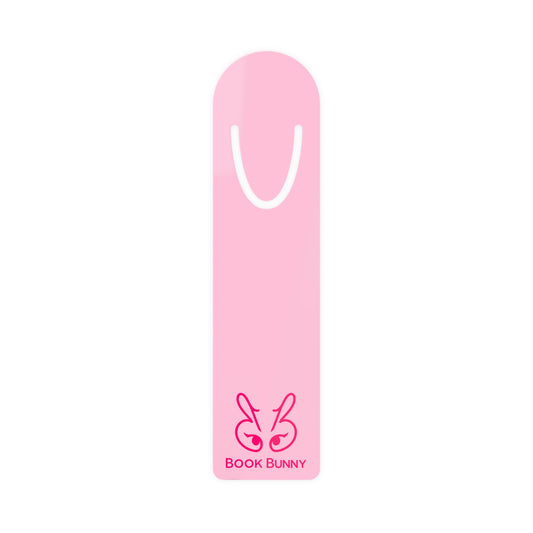 A pink book mark shaped like a bunny head with the text 'BOOK BUNNYY' printed at the bottom, shown on a plain white background.